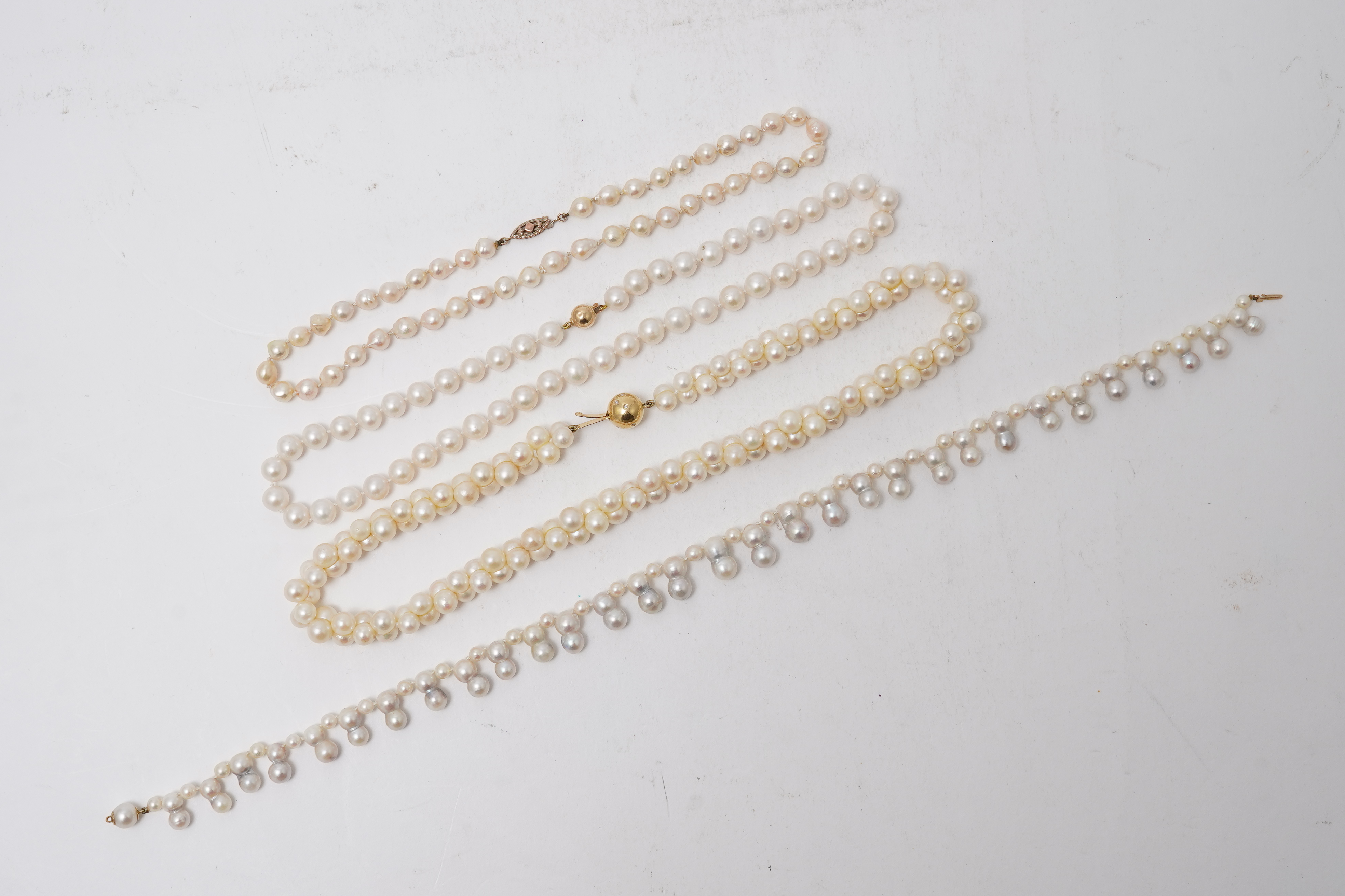 A collection of four cultured pearl necklaces
